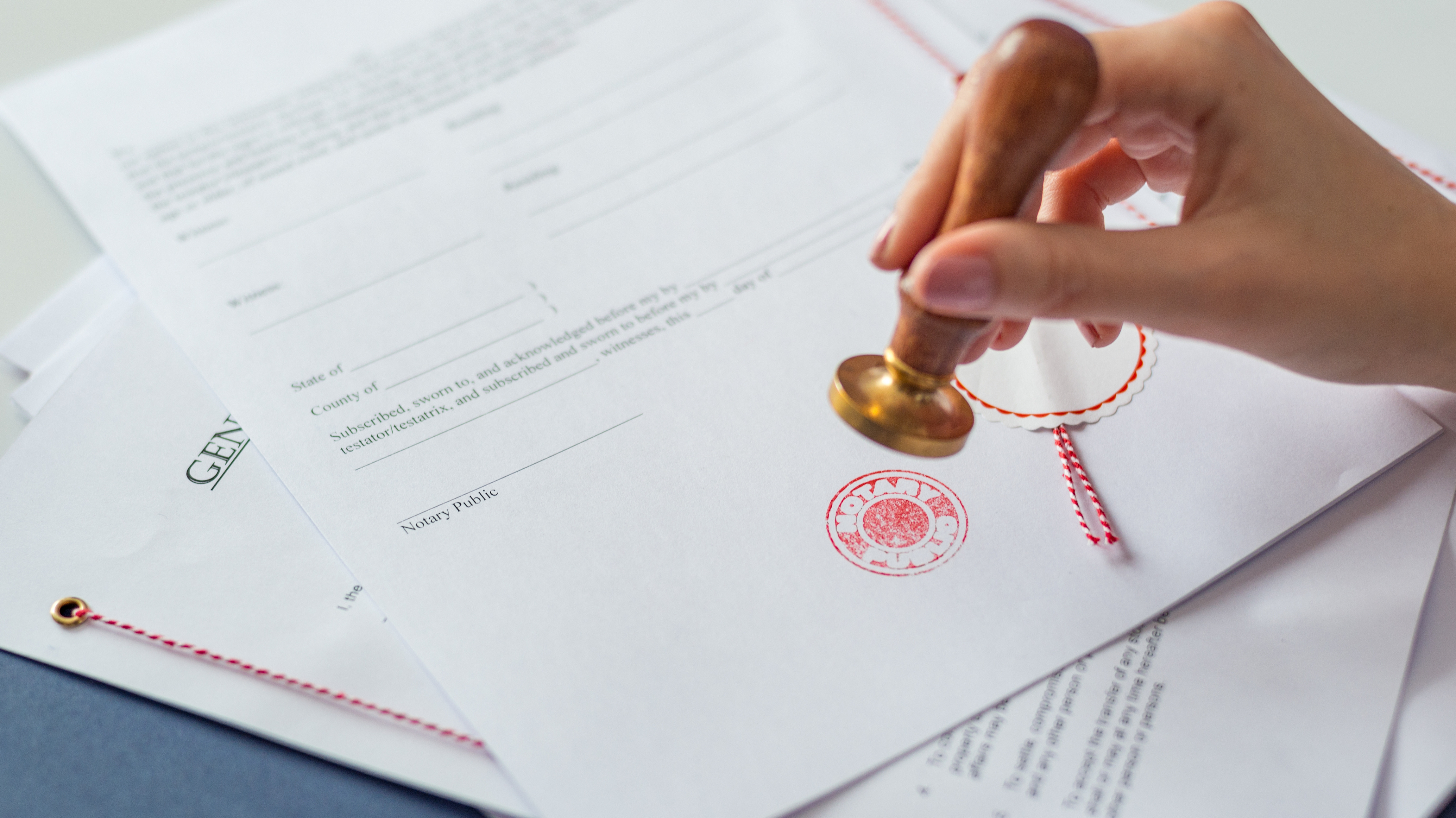 Certified notary verifying and notarizing legal documents for clients.